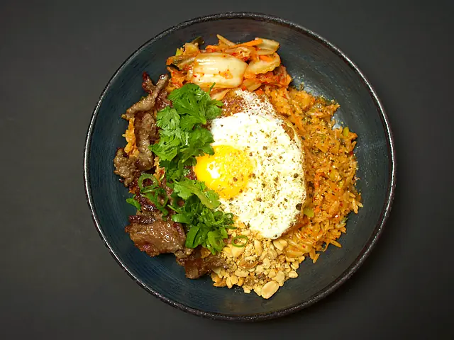 K-Rice: kimchi fried rice with beef, fried egg and coriander